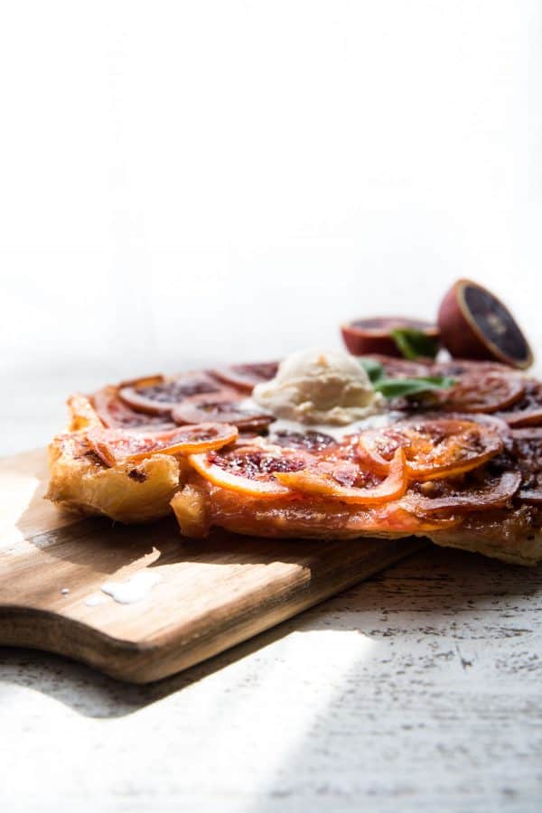 puff pastry tart on wood cutting board