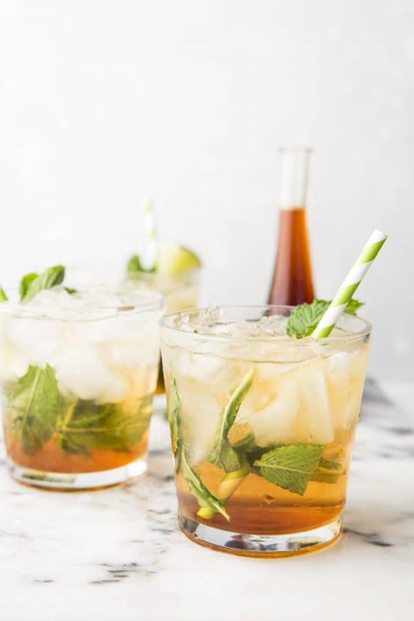 three glasses with ice and mint juleps