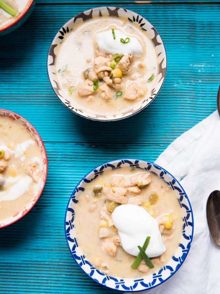 over head view of the three bowls of white chicken chili