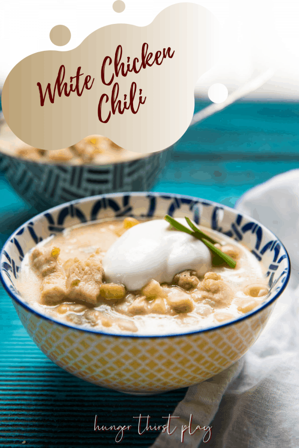 dollop of sour cream on top of bowl of chili
