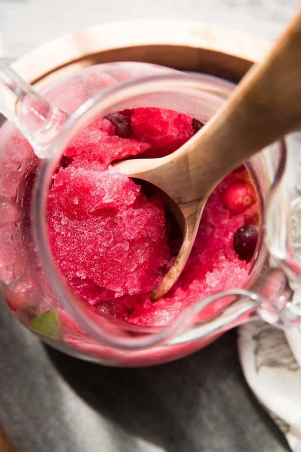 pitcher filled with frozen cranberry vodka slushies