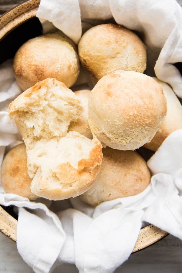 overhead of a bowl filled with fresh baked rolls
