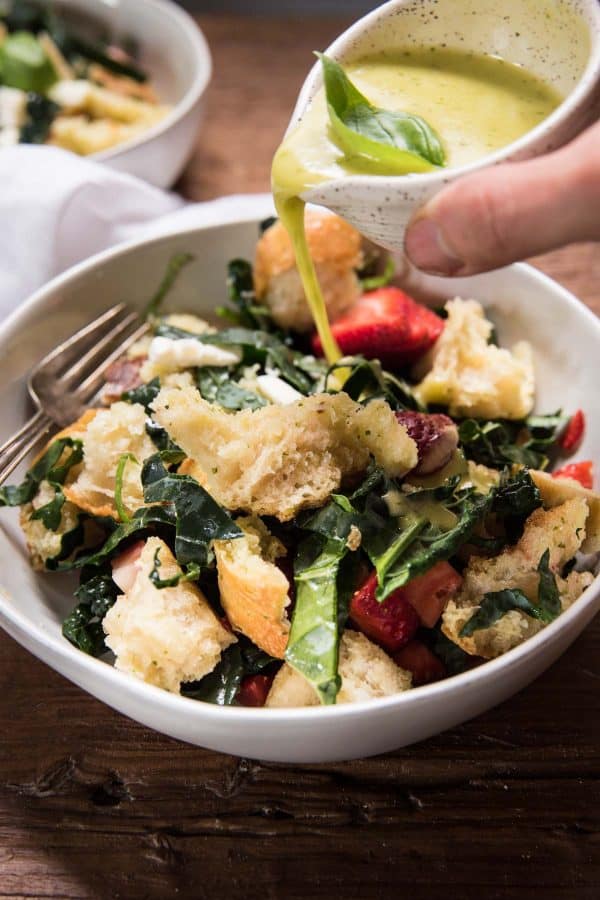 dressing pouring over salad