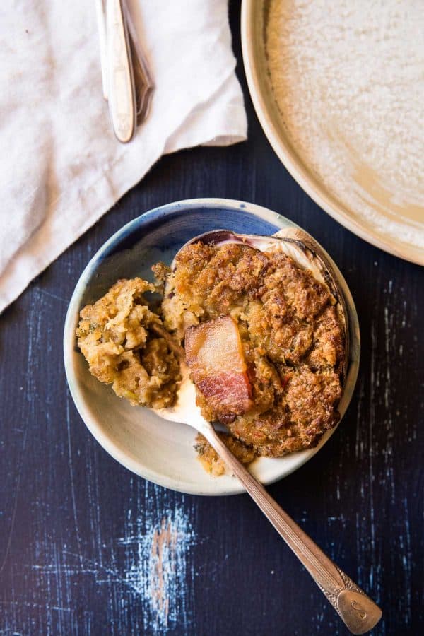 one baked stuffed clams with a forkful on a plate