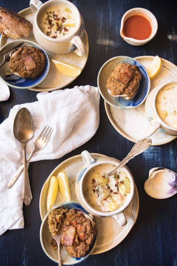 overhead of baked stuffed clams and bowls of new england chowder