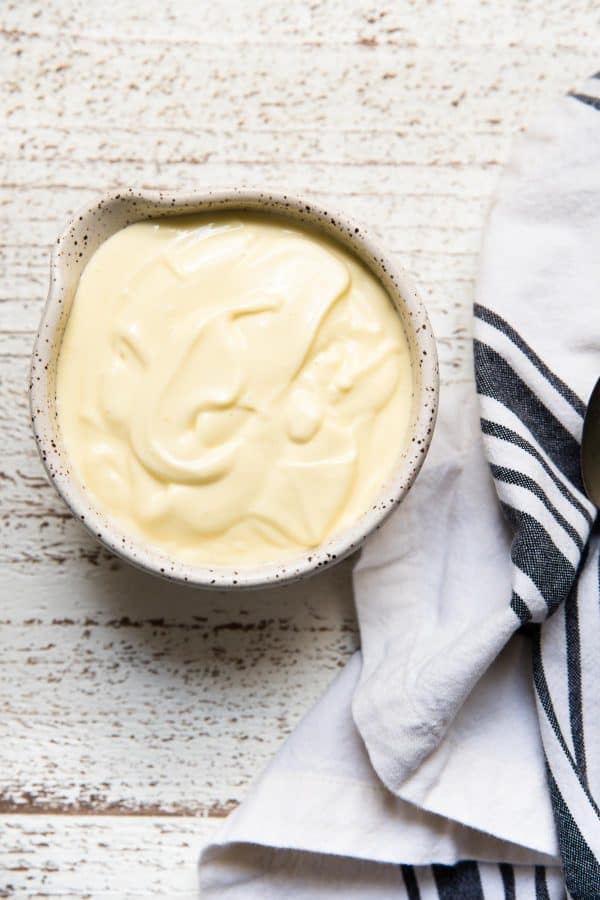 overhead photo of truffle aioli in a bowl with napkin