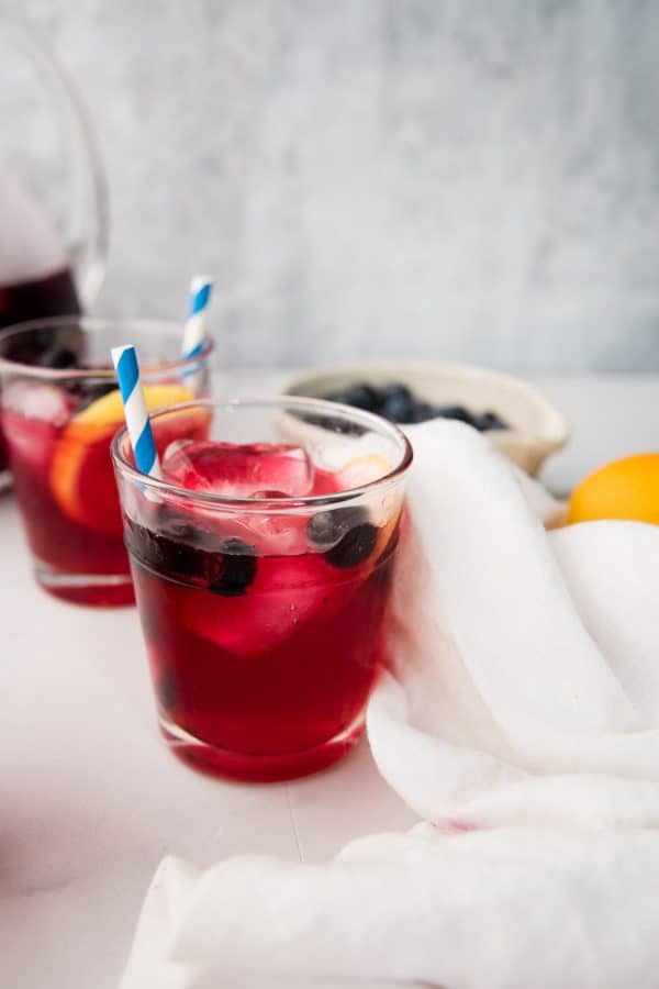 close up of blueberry lemonade in a glass