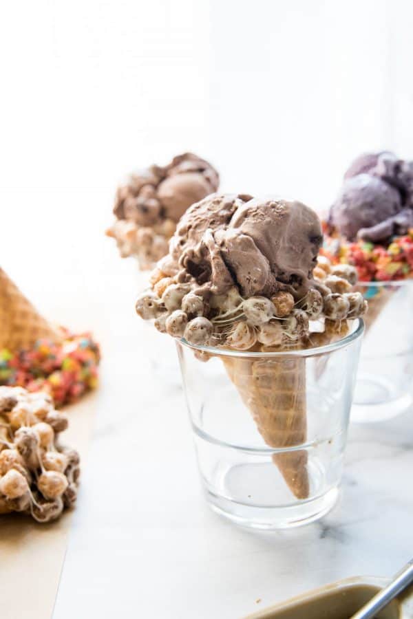 side angle of chocolate cereal treat covered cone in a glass
