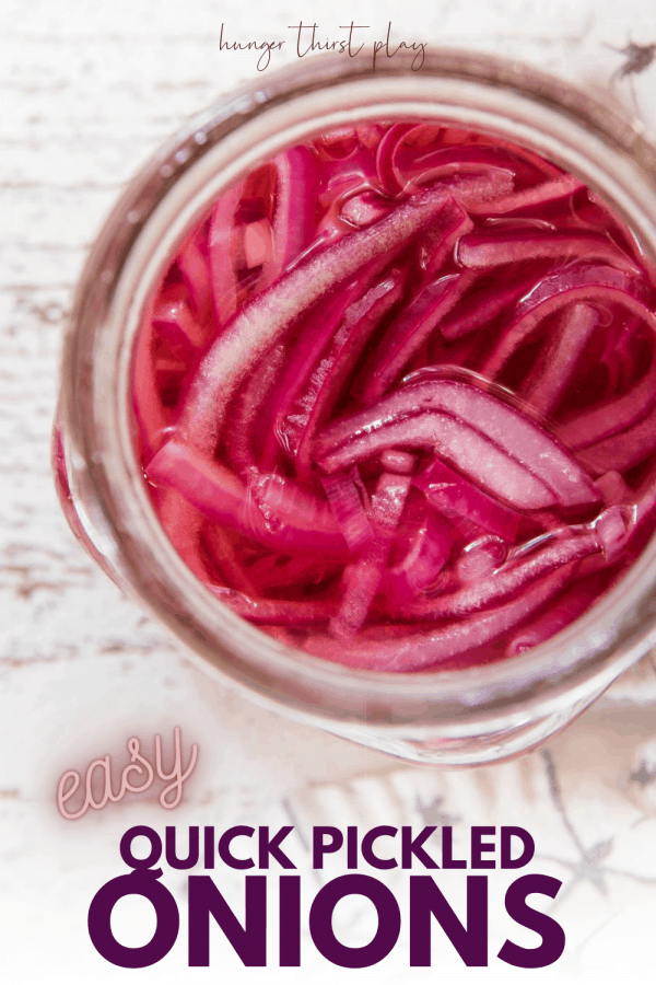 overhead of pickled onions in a mason jar