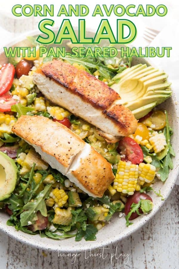 close up of pan seared halibut over corn and avocado salad