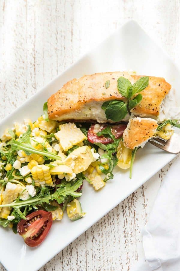 forkful of halibut and corn salad