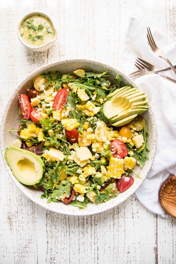 overhead photo of a large platter filled with summer salad ingredients