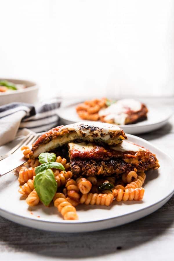 pieces of chicken parmesan cut in the middle and layered on top of each other