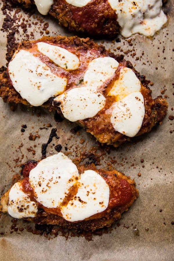 broiled chicken parmesan on parchment paper