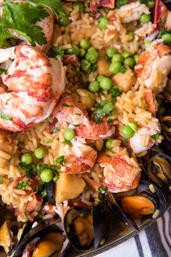 close up of rice peas and lobster