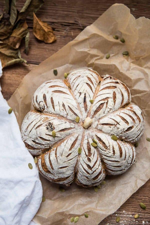 overhead of pumpkin shaped sourdough bread