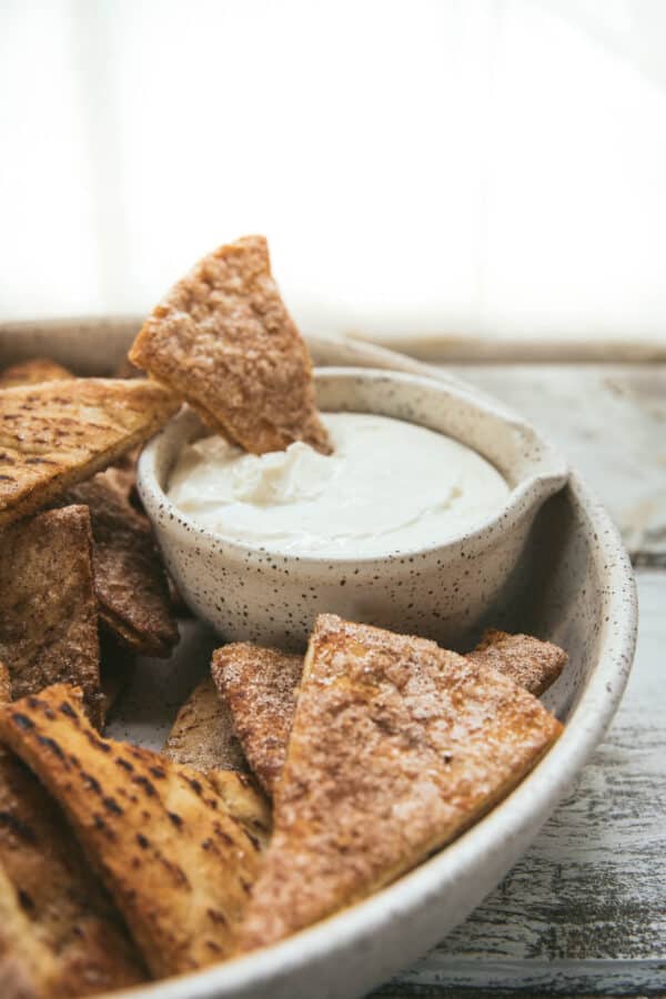 sweet chip dipping into creamy vanilla dip