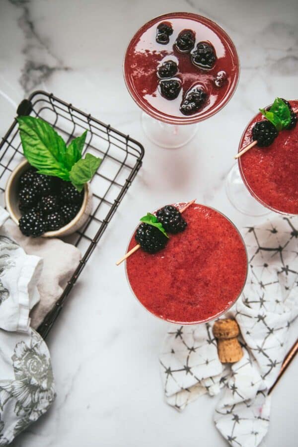 overhead angle of martinis with blackberry garnish