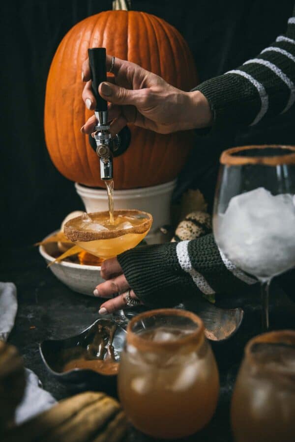 pouring beverages out of a tapped pumpkin