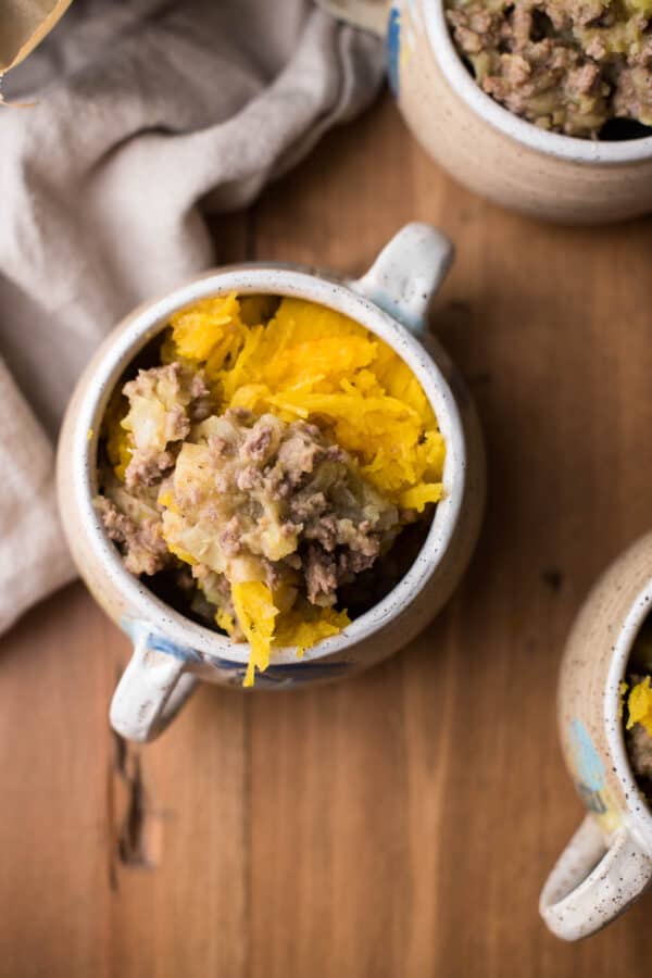 overhead of roasted pumpkin and stuffing in a bowl