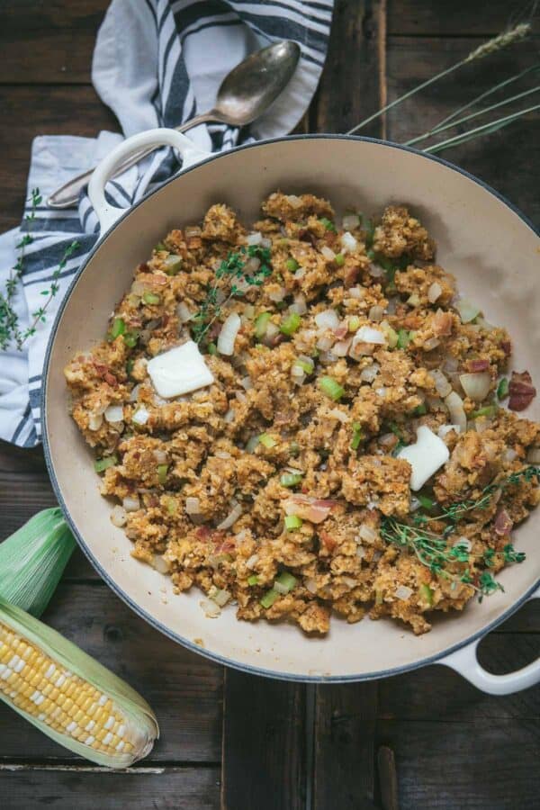 overhead of cornbread stuffing in a skillet with butter