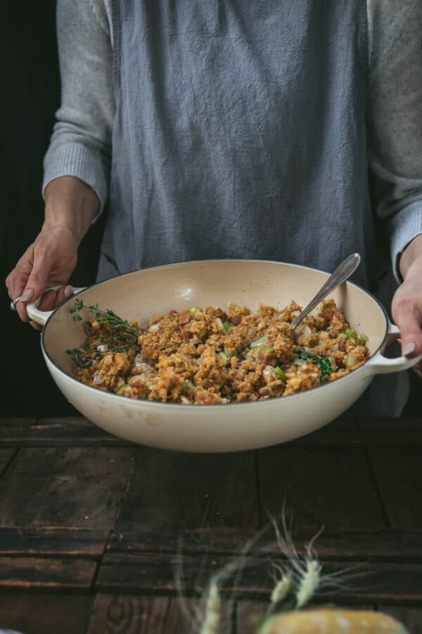 holding a skillet with two hands