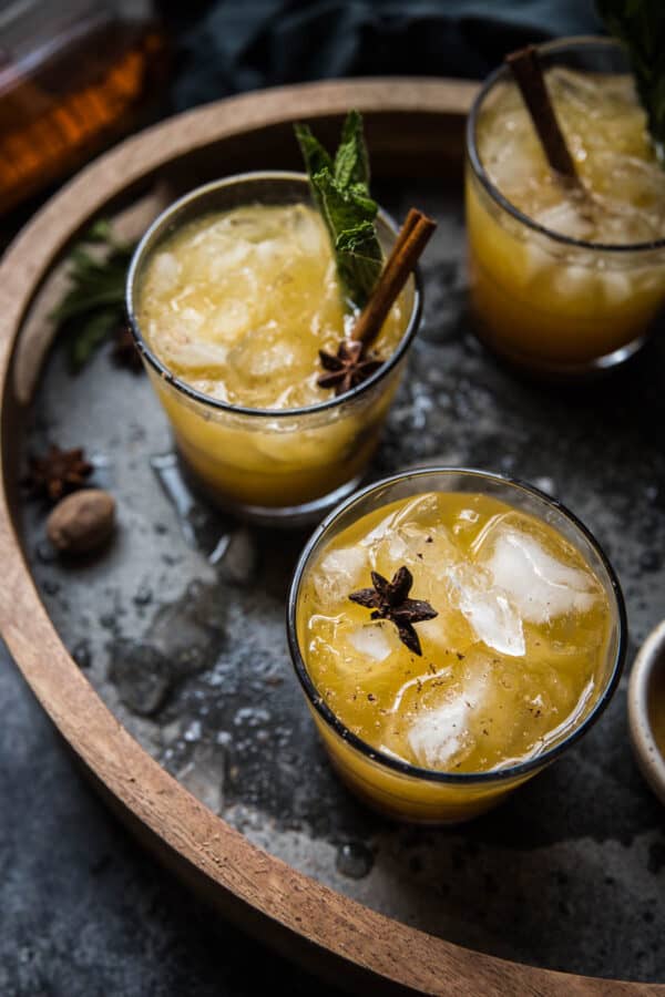 close up overhead angle of pumpkin smash cocktails over ice on a drink tray