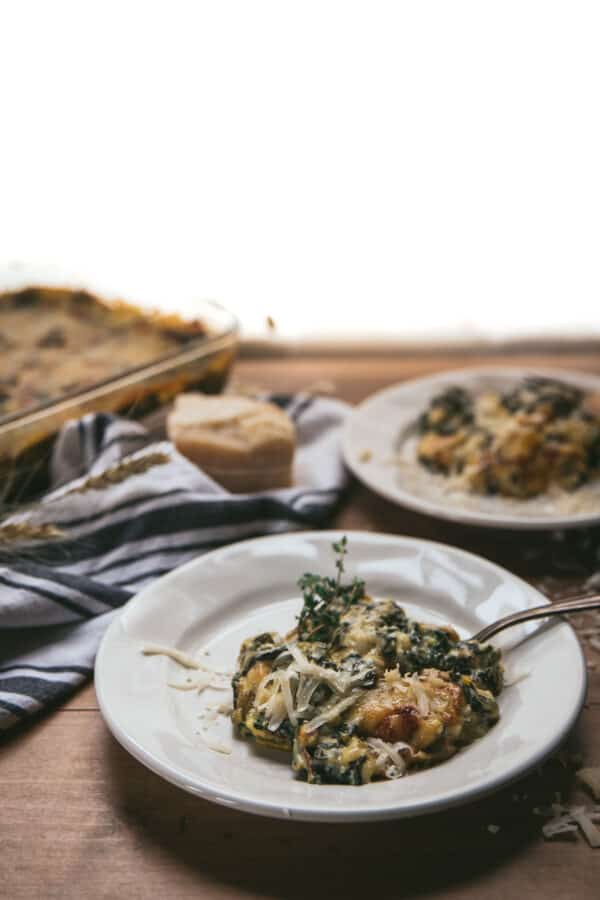 au gratin on small white plates and baking dish in background