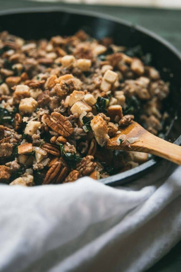 side angle of country style stuffing in a cast iron pan