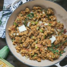 overhead of cornbread stuffing in a skillet with butter