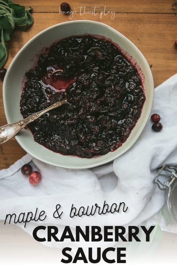Homemade cranberry sauce in a mouth with white linen on table