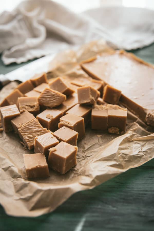 cut pieces of gingerbread fudge on a piece of parchment paper