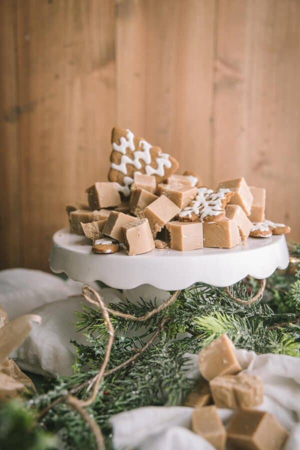 gingerbread fudge cut in pieces on a white cake stand