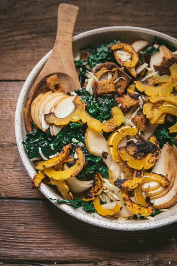 close up of roasted squad and pear on a salad