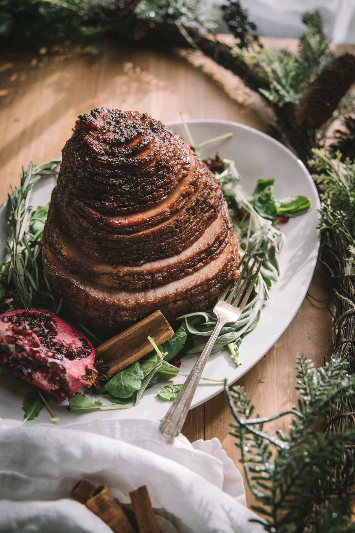 boneless spiral cut ham with glaze on a platter