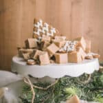 gingerbread fudge cut on a cake stand with cookies