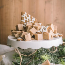 gingerbread fudge cut on a cake stand with cookies