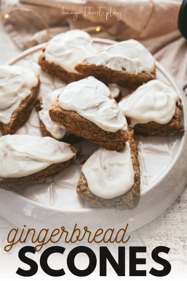 gingerbread scones with cream cheese frosting on a platter