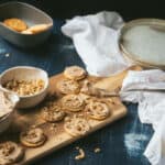 frosted ritz crackers on wooden cutting board