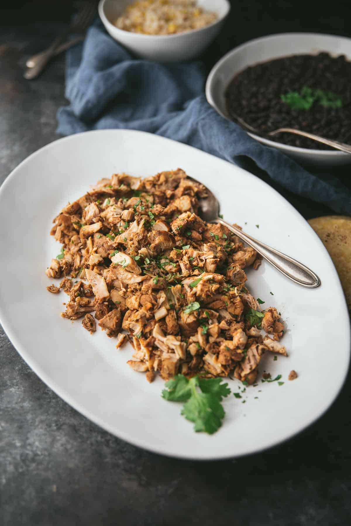 chicken, beans, and rice on a platter