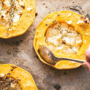 spoon scooping squash from rind