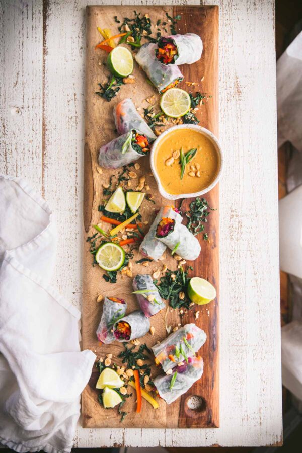 Rainbow Vegggie Spring Rolls on a wooden board