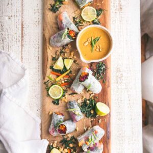 Rainbow Vegggie Spring Rolls on a wooden board