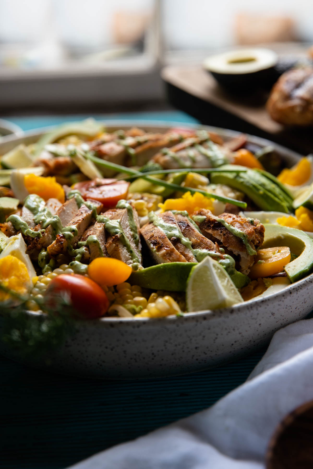 side angle of serving bowl filled with salad ingredients