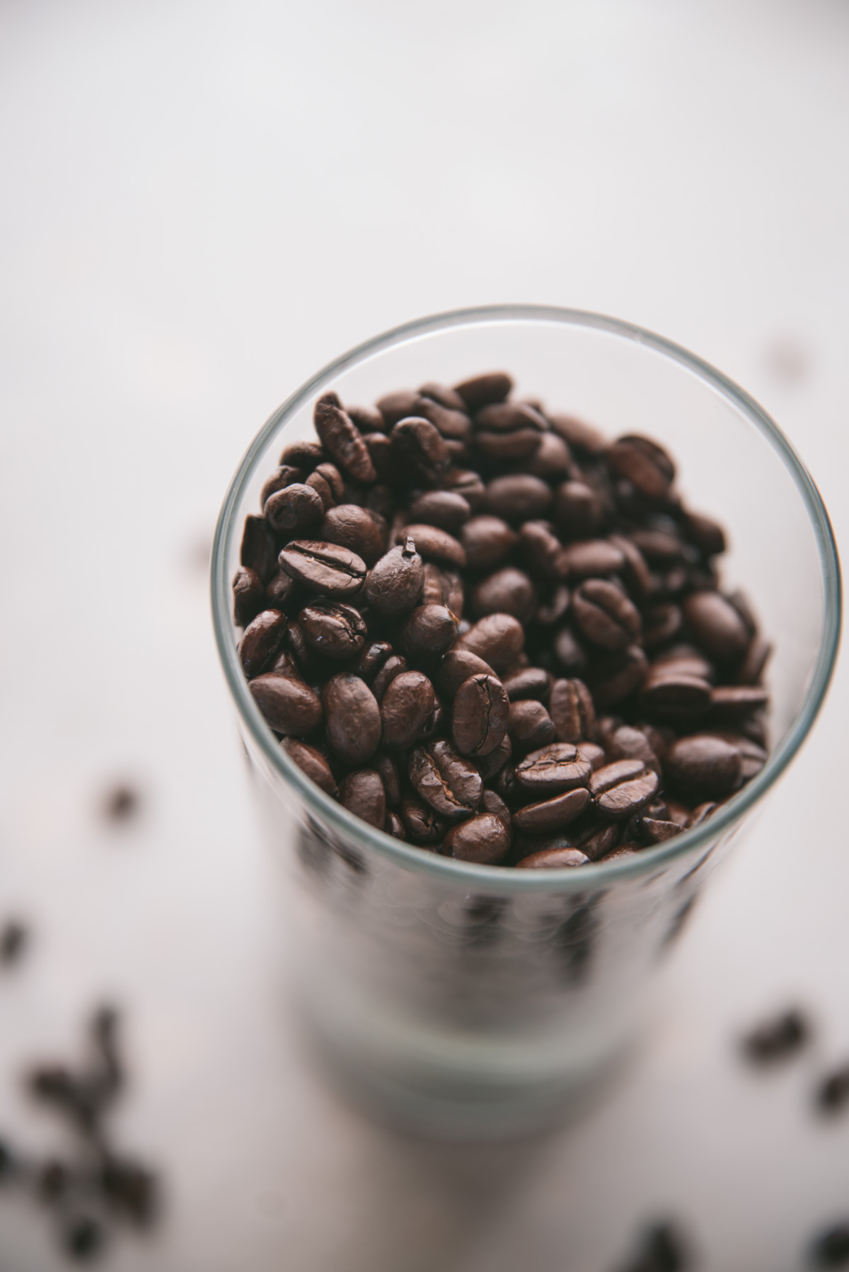 close up of coffee beans in a glass
