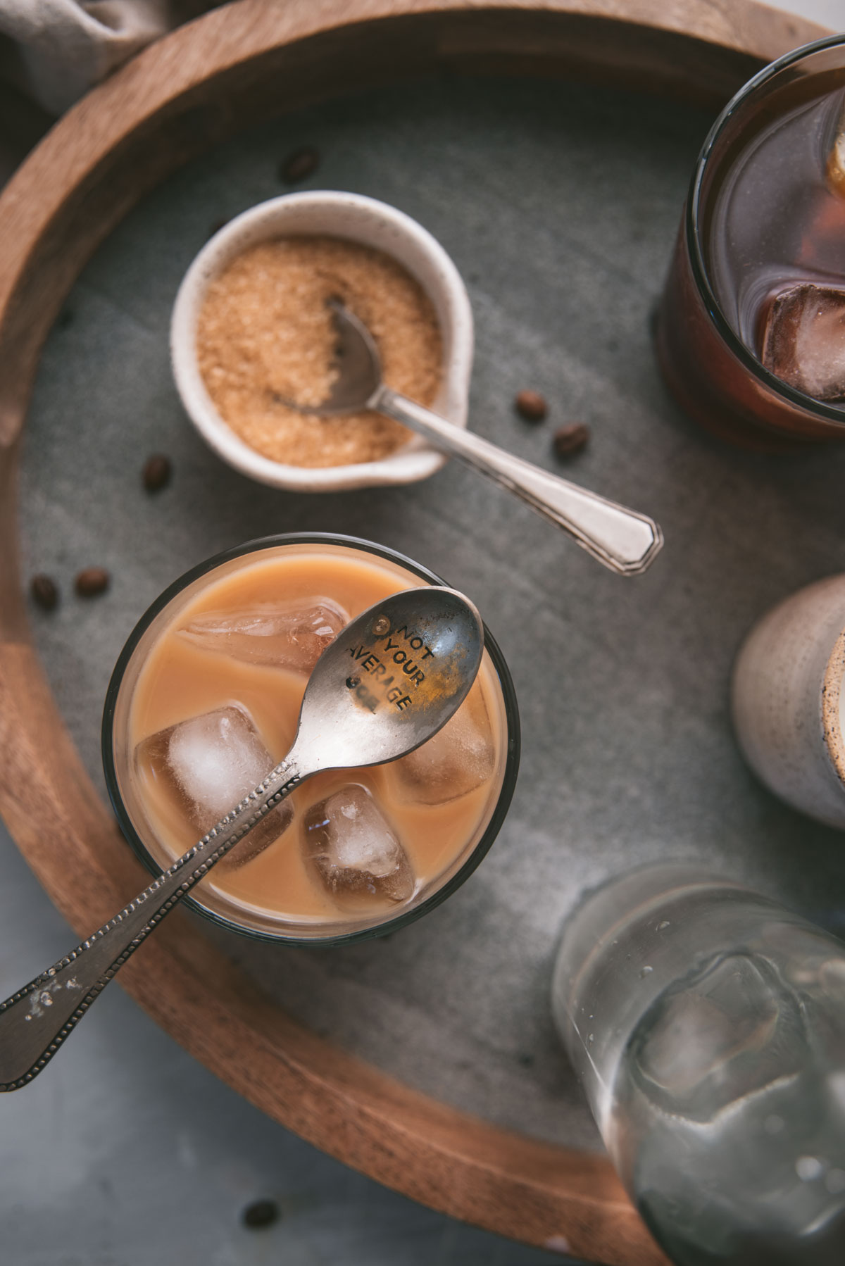 overhead image of iced coffee mixed with milk