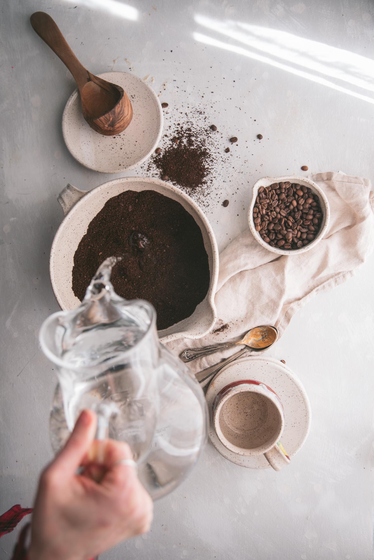 pouring water over coffee grinds