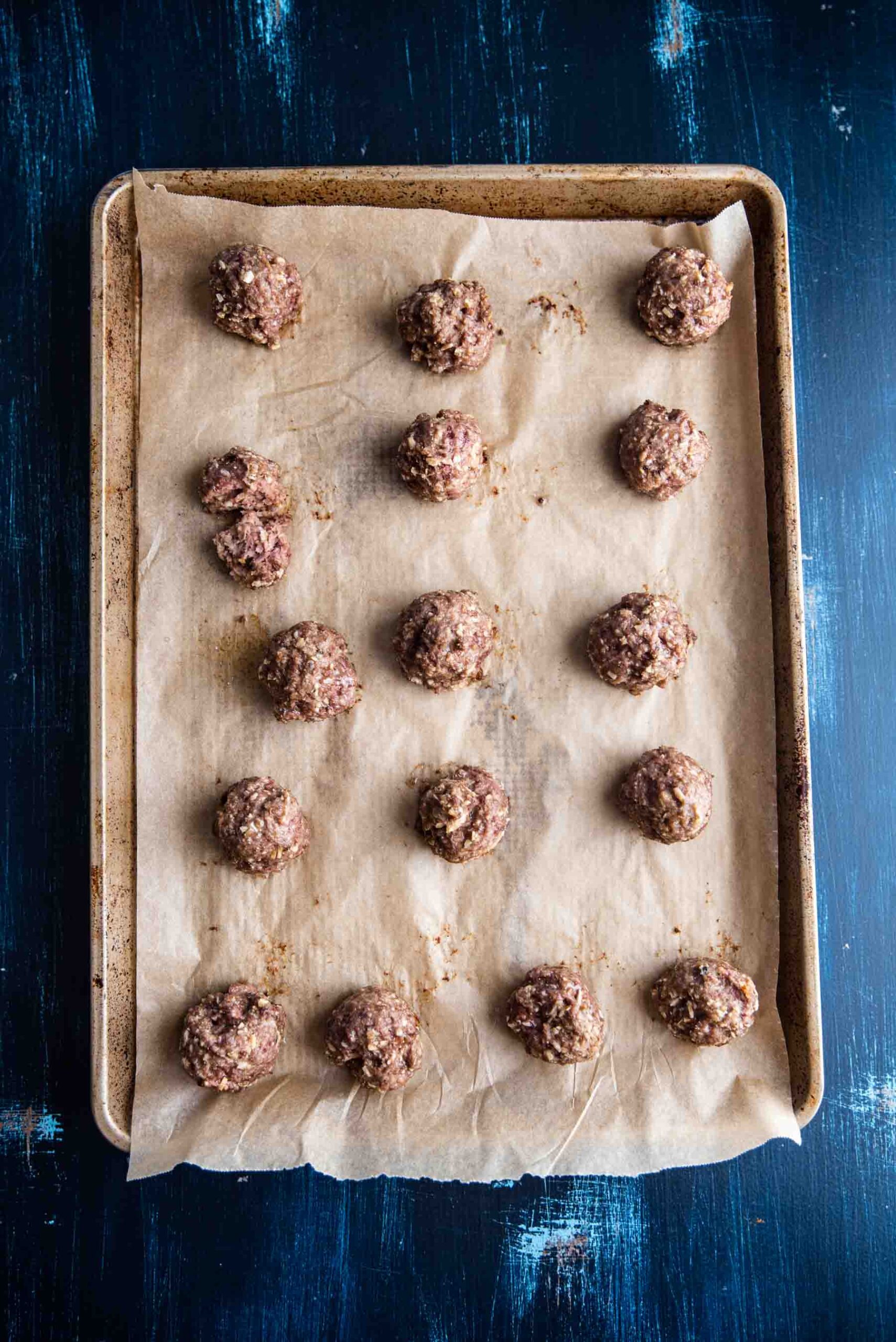 baked lamb meatballs on a sheet tray