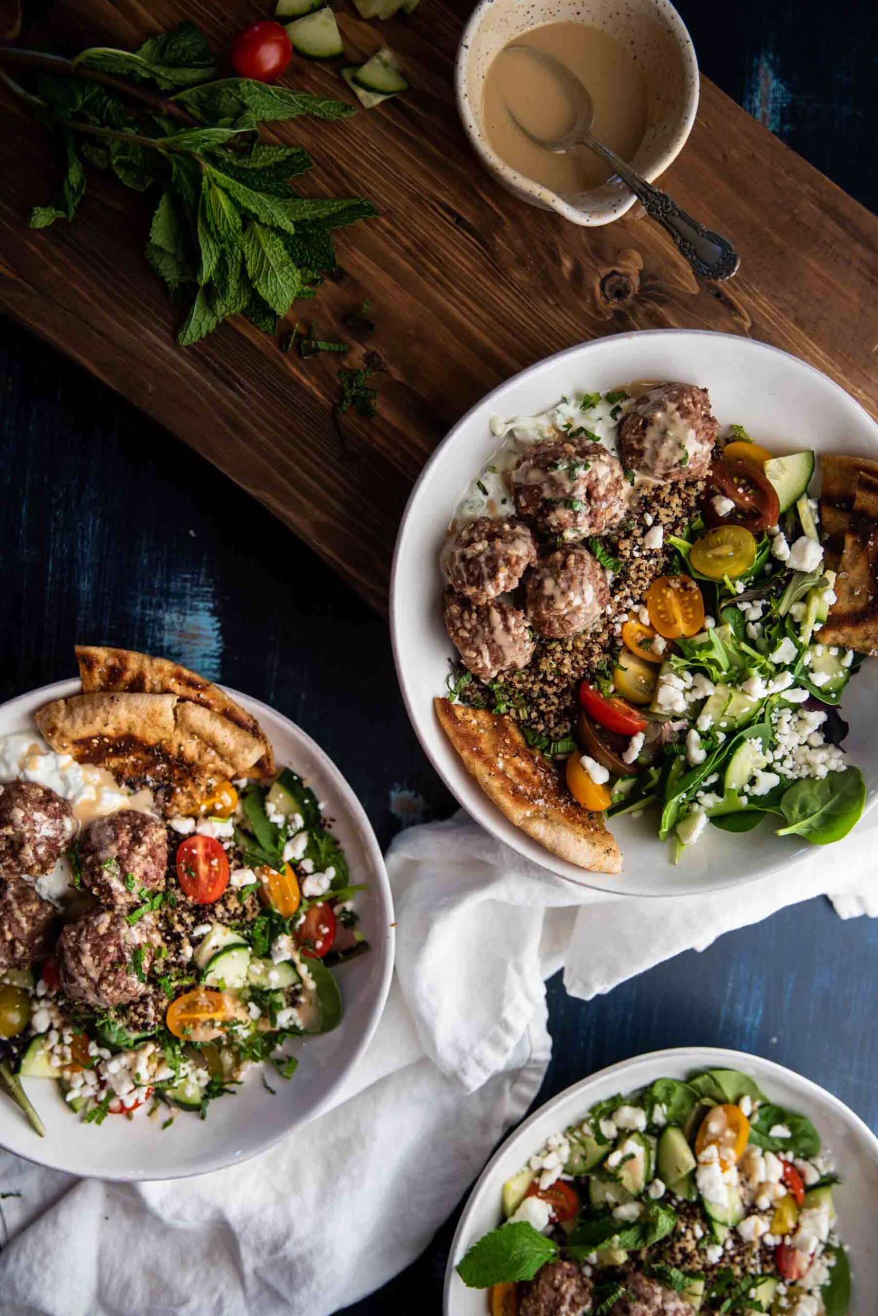 overhead photo of quinoa bowls with meatballs