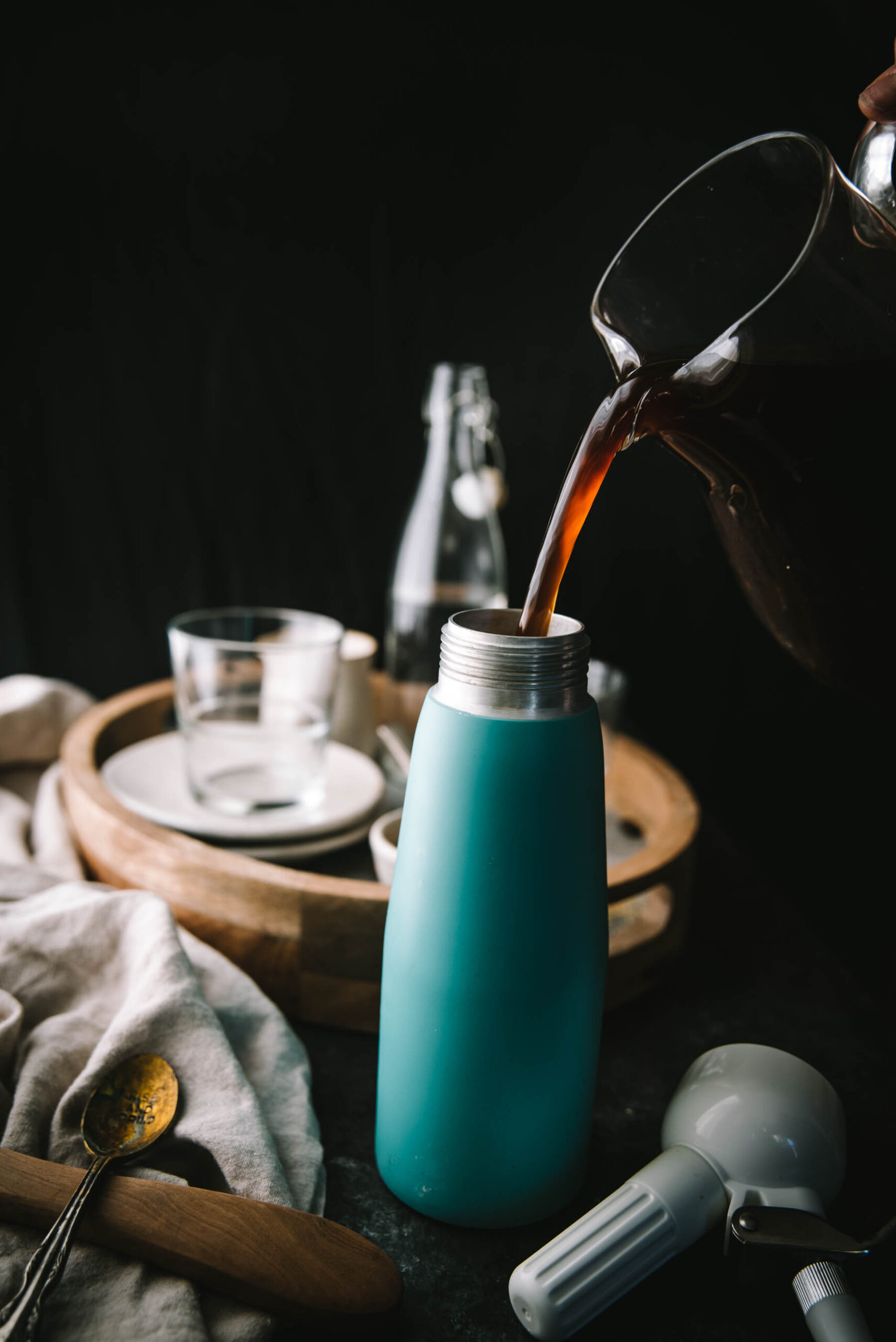 pouring coffee into a whipped cream canister